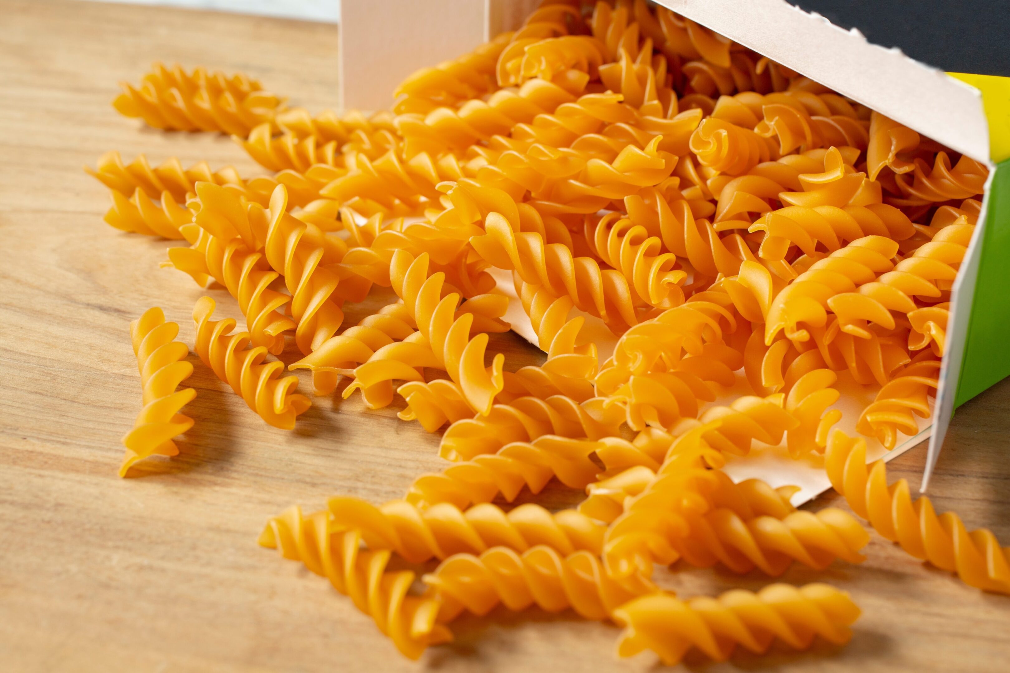 A,View,Of,A,Pile,Of,Gluten-free,Rotini,Pasta,Spilling