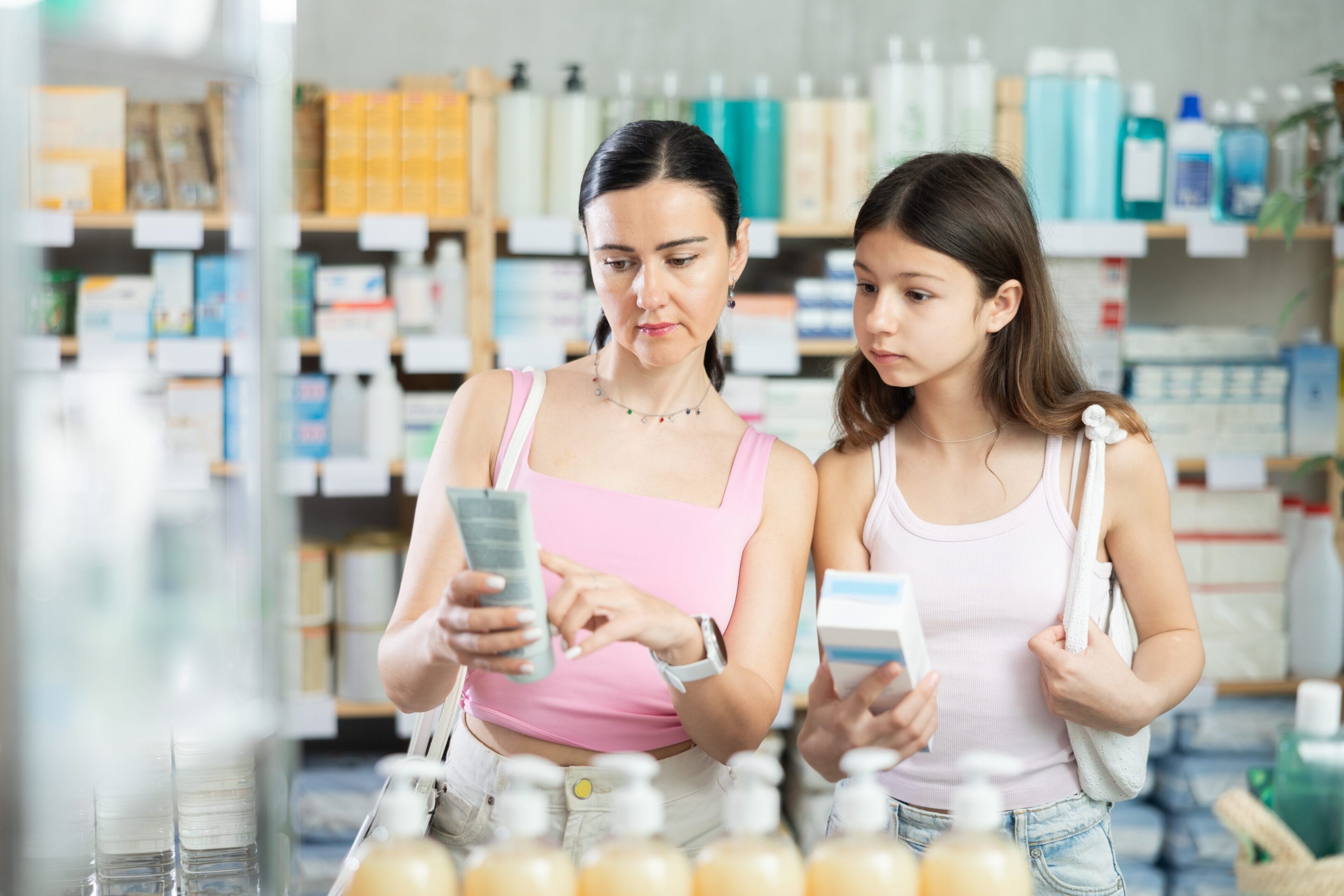 Attentive,Mom,And,Daughter,Holding,Cream,Trying,To,Make,Choice